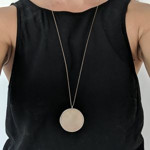 Gold colored pendant necklace
